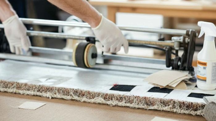 Homeowner using preventive measures to protect carpet and avoid future damage