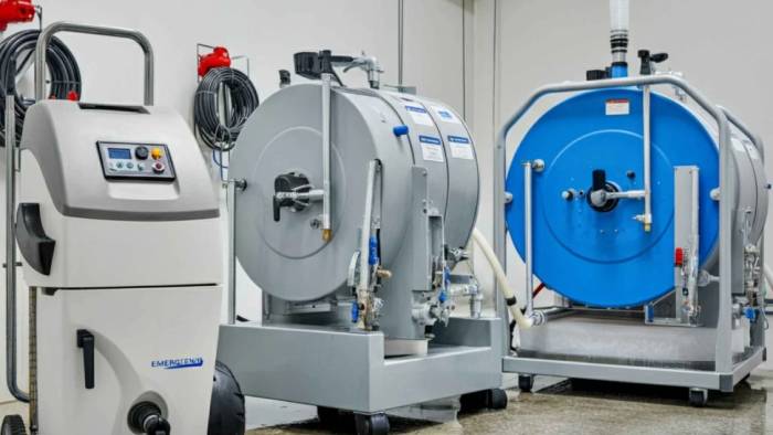 Professional using specialized equipment and techniques for emergency carpet cleaning