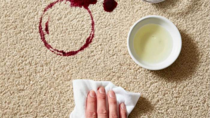 Different types of stains on fabric with a clock symbolizing quick action to remove them