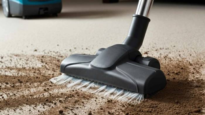 Vacuuming the carpet to prepare for a professional carpet cleaning service